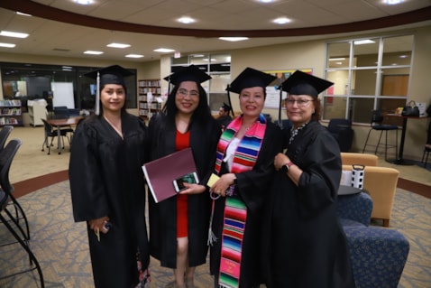 Students in cap and gown for GED graduation